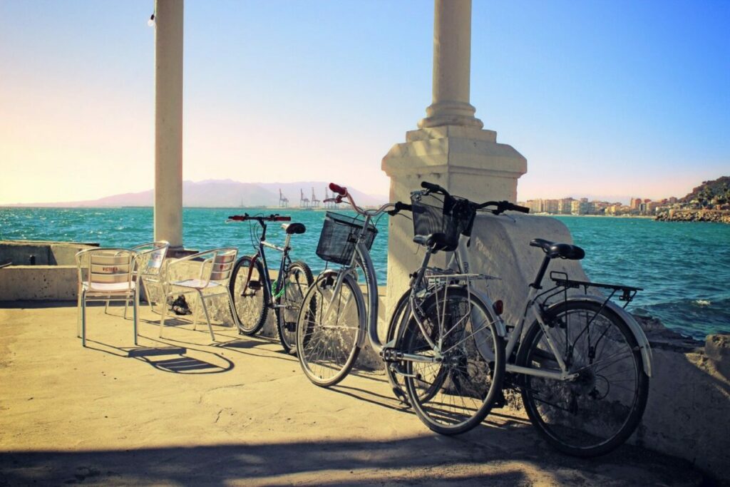 Bikes resting along the port next to the ocean in Malaga