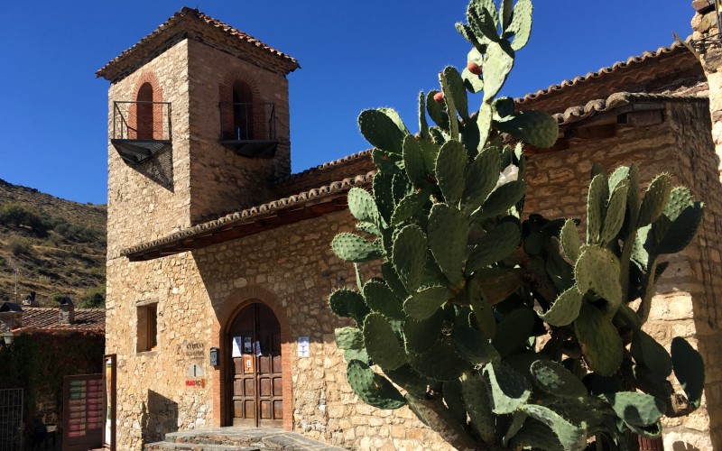 A cactus infront of the church in the village of Patones de Arriba in the Sierra de Guadarrama mountains in the community of Madrid.