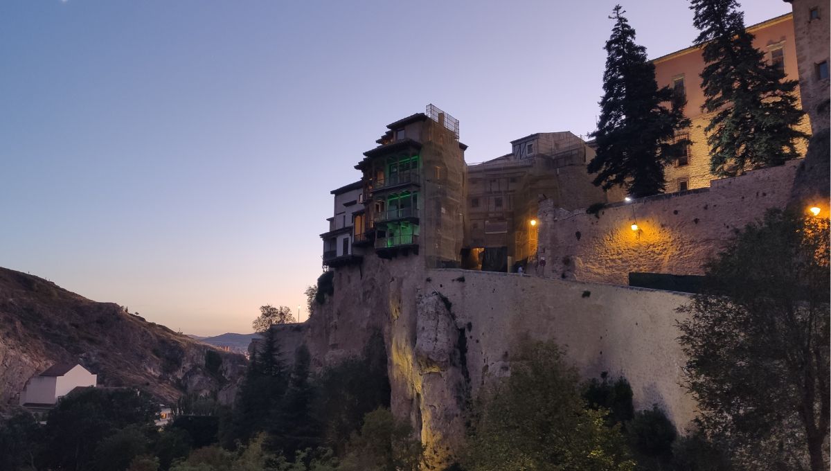 A view of the hanging houses in Cuenca, Spain, at dusk